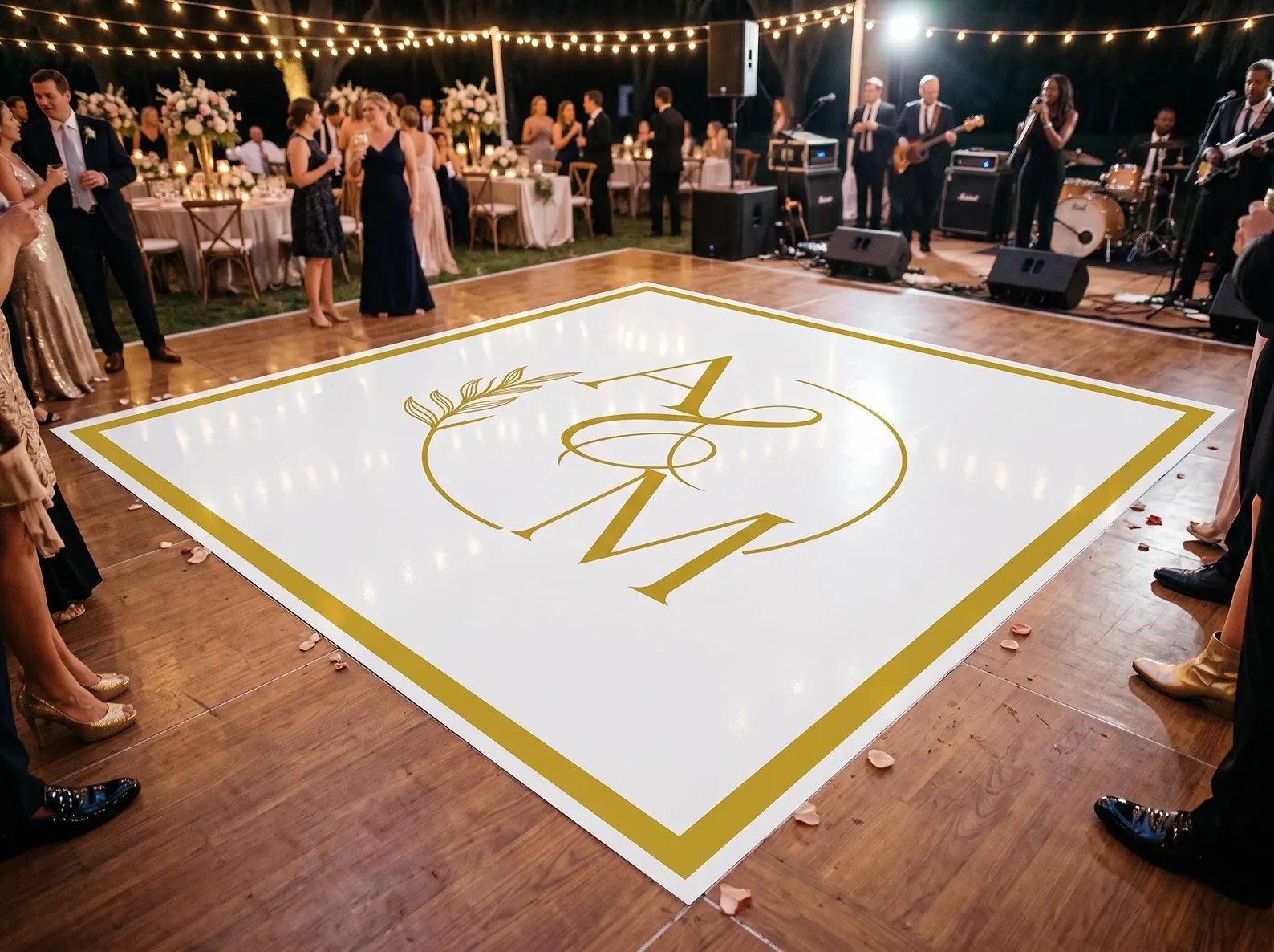Custom gold monogram vinyl wrap dance floor at a Los Angeles wedding reception